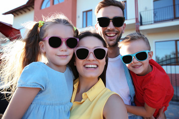 Family with kids taking selfie near car outdoor