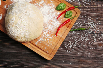 Preparation homemade pizza on kitchen table