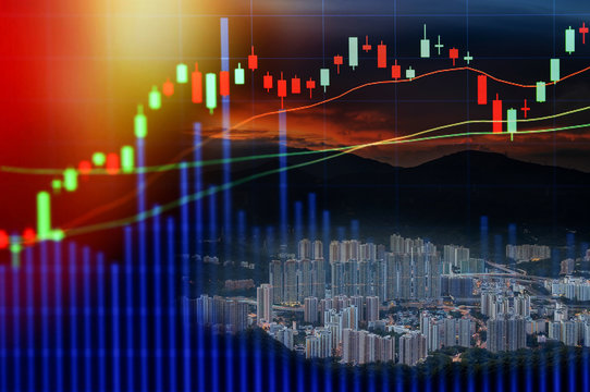 Double exposure of stocks market chart in blue on LED display concept with city scape hong kong background