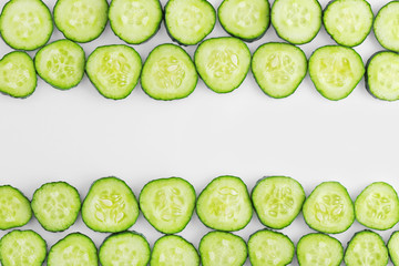 Sliced fresh cucumber on white background