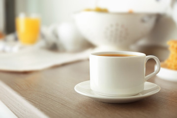 Cup of morning tea on kitchen table