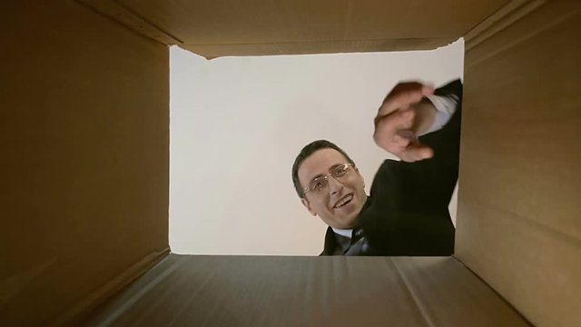 Man opens a parcel box. with different versions of emotions and being surprised.