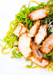  Selective focus in center, Egg noodles served dry with red roast pork