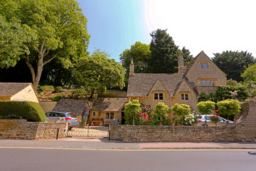 English Country Cottage in the sunshine in Cotswolds, England, UK