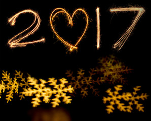 happy new years 2017 fireworks Sparkle alphabet on gold bokeh background. HAPPY NEW YEAR concept.