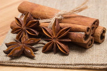Star anise and cinnamon sticks on wooden table, seasoning for cooking