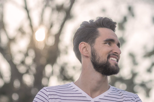 Smiling Young Adult Man, Looking Sideways, Head Face Close Up.