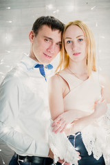 loving couple on a background garlands of lights