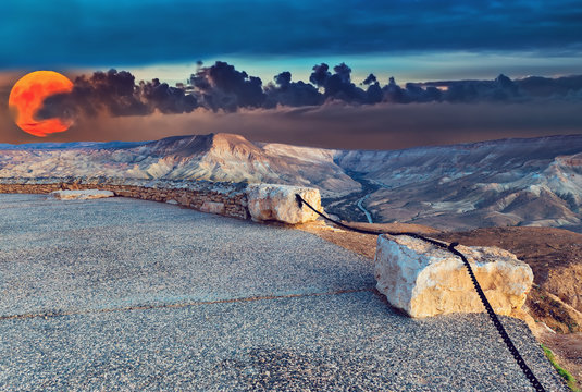 Super-moon above mountains in desert of the Negev, Israel