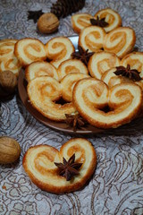 Cookies in the shape of hearts, stars and spices. Magical Christmas - selective focus
