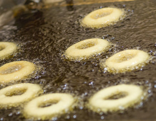 Donuts Frying In Vegetable Oil