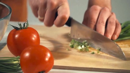 Chef cuts the vegetables slow motion