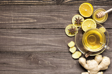 Fototapeta na wymiar cup of ginger tea with lemon, honey and spices