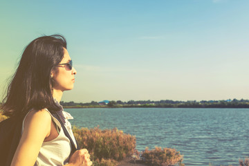  portrait of pretty young woman travel along road by hitchhiking