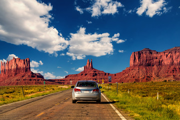 Highway in Monument Valley, Utah / Arizona, USA - Picture with road and cars driving towards the...