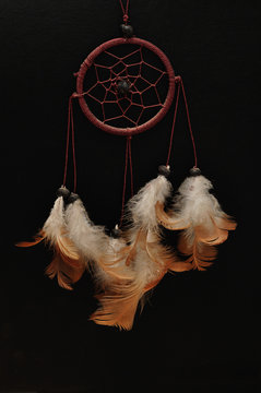 A dream catcher isolated on a black background