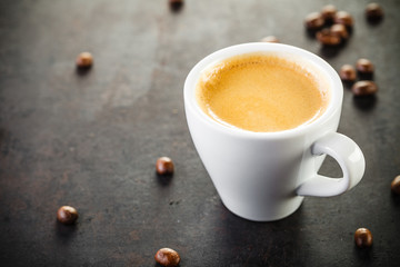 cup of espresso on old rustic background