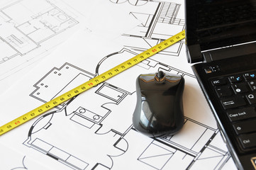Ruler and notebook on a floor plan