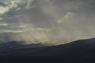 Beautiful sun ray while raining over mountain