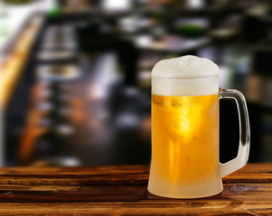 cold light beer glass mug in a pub