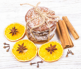 Gingerbread cookies, cinnamon and orange slices. Christmas decoration.