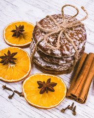Gingerbread cookies, cinnamon and orange slices. Christmas decoration.