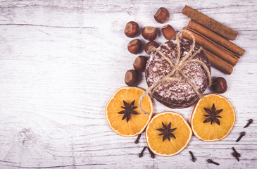 Gingerbread cookies, cinnamon and orange slices. Christmas decoration.
