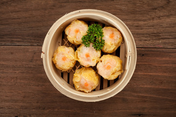 Chinese dim sum in a bamboo steamer box