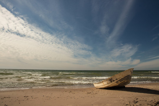 Fishing boat on Baltic beach in Ventspils © dmitrybunin