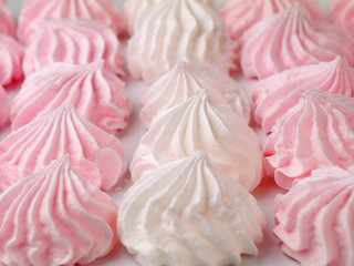 Obraz na płótnie Canvas white and pink meringue cookies, shallow depth of field, selective focus