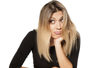 Beautiful blonde with messy hair is bored