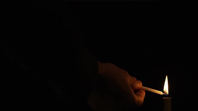 4K Flaming fountain sparkler lit by a candle, in slow motion