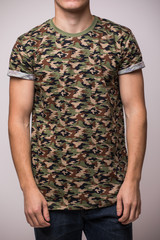 Obraz premium Front t-shirt on a young man isolated
