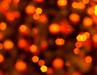 Fototapeta premium Colorful lights on red background. holiday bokeh. Abstract Christmas background