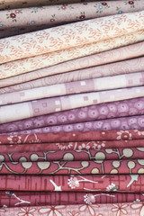 a lot of  fabrics different textures and colors
