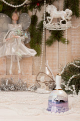 Christmas New Year holiday concept. Bell with deers, white garla