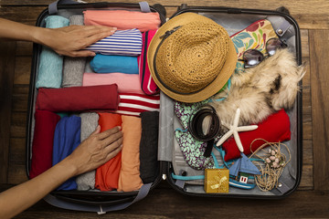 woman packing a luggage for a new journey