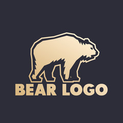Bear logo element, gold on dark