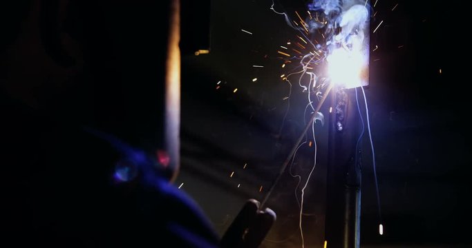Welder welding a metal