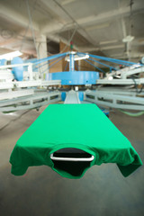 Green t-shirt silk screen printing machine, look of the mock up clothing before high quality...