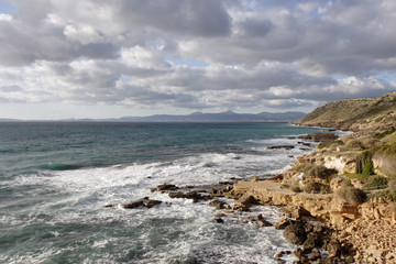 Mediterranean seascape with rocky coast and mountains of Mallorc