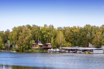 Boat station on the river on the Siberian river