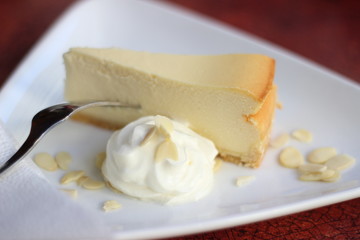 Restaurant food with fresh ingredients - cheescake with whipped cream