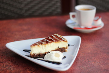 Restaurant food with fresh ingredients - chocolate cake with whipped cream and coffee