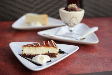 Restaurant food with fresh ingredients - cake with whipped cream and tiramisu desert