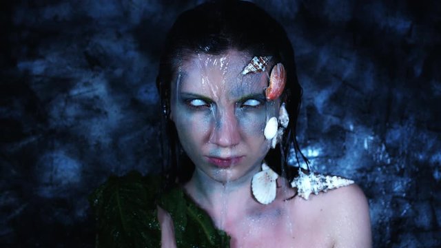 4k Halloween Shot of a Horror Woman Mermaid and Water Pouring on her Head