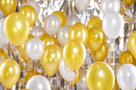 Golden and silver balloons background. New Year concept