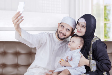 Arabian parents and son take selfie photo