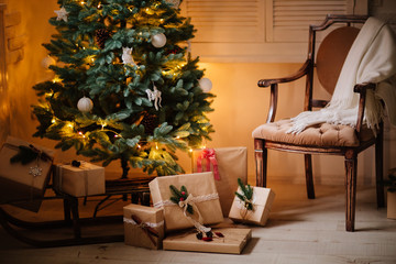 beautiful Christmas gifts under tree in new year decorated house interior