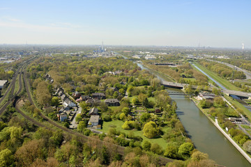 View over railroad tracks and Rhein-Herne-Kanal in Oberhausen, Germany.